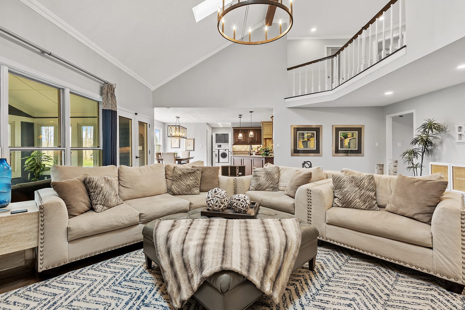Two-story living room with chandelier