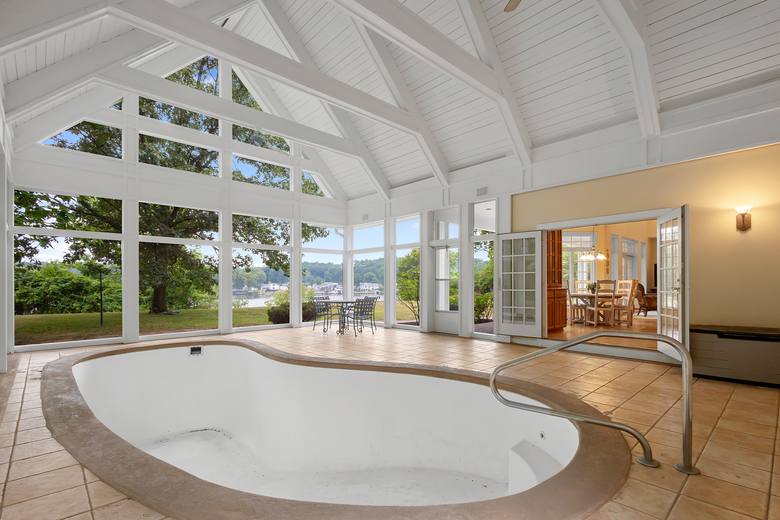 Cinematic interior — vaulted room with a wall of windows